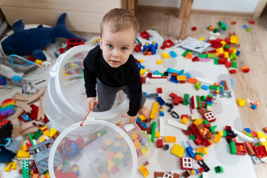 Child playing with colorful building blocks