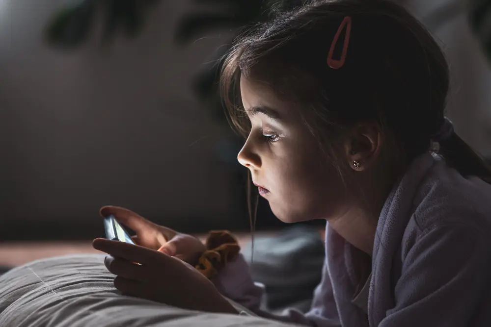 girl using mobile before going to sleep
