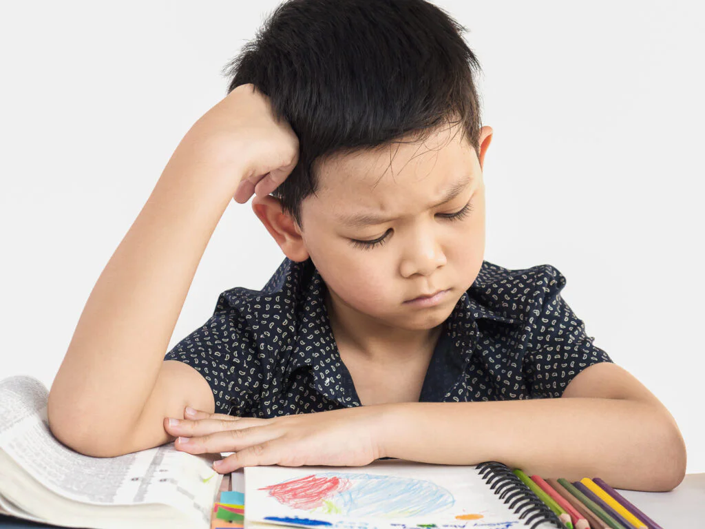 Red Flags in Toddler Development (1-3 Years): Signs of Developmental Delay Parents must not ignore (A comprehensive guide to Pakistani parents) 3 boy is unhappy doing homework