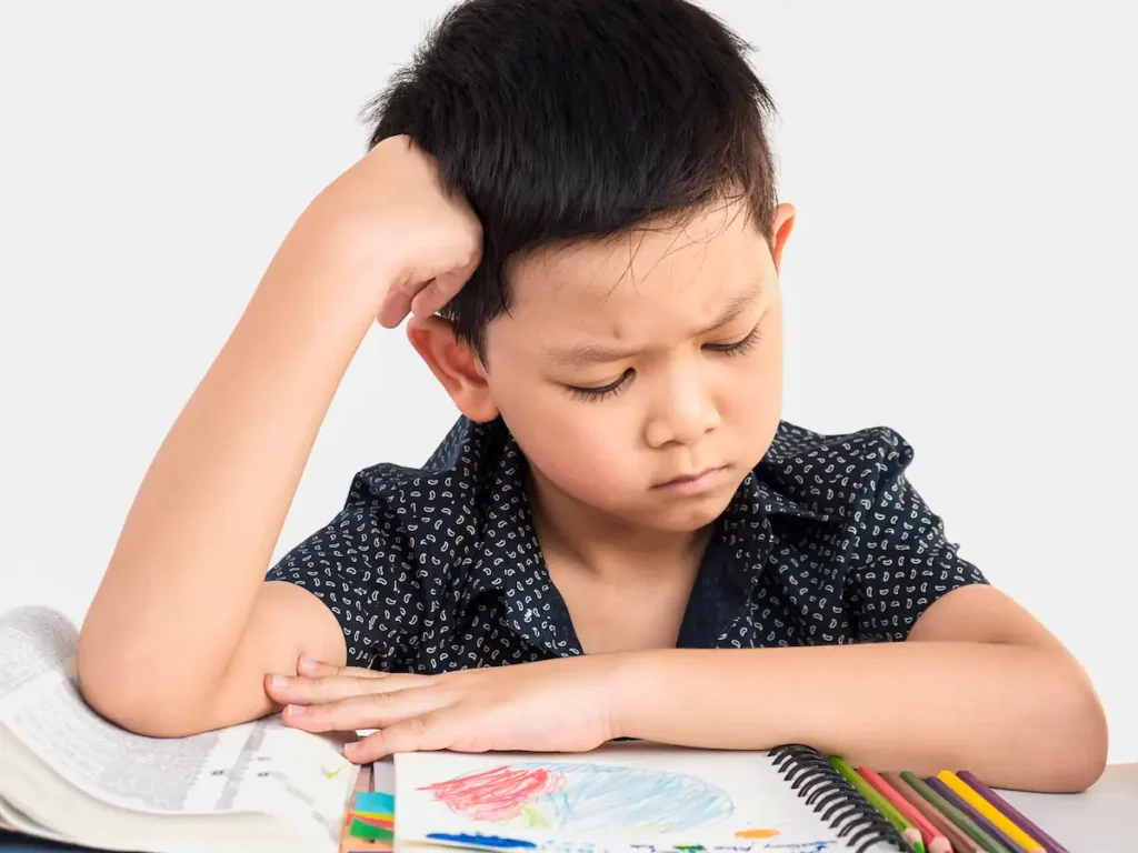 Red Flags in Toddler Development (1-3 Years): Signs of Developmental Delay Parents must not ignore (A comprehensive guide to Pakistani parents) 3 A boy is unhappy doing homework
