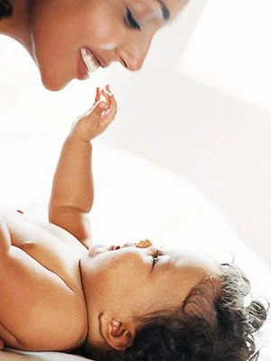 mother playing with her baby