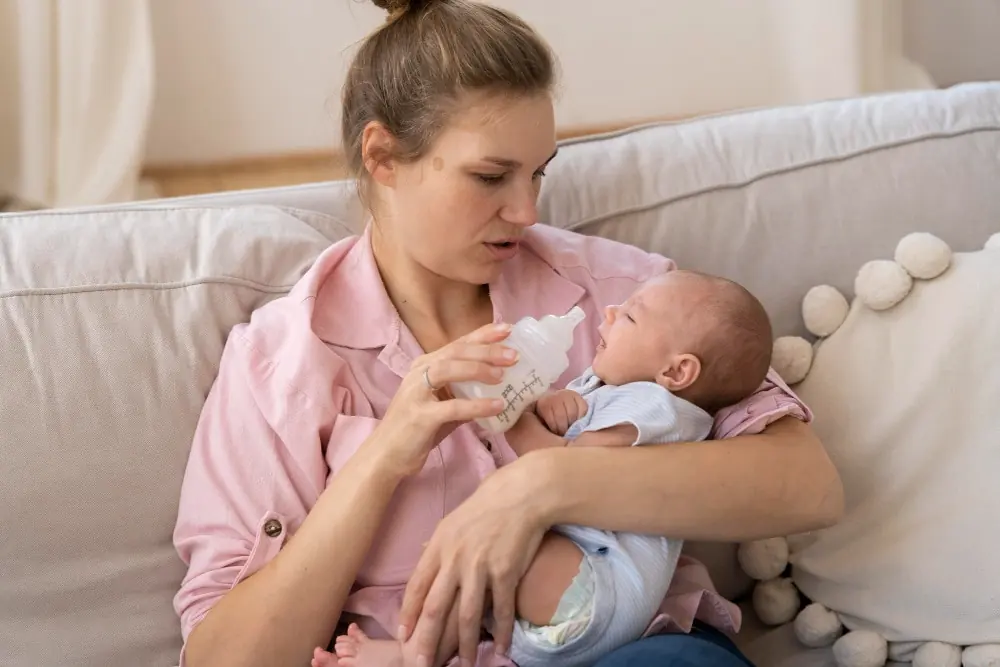 Mother feeding her new born baby