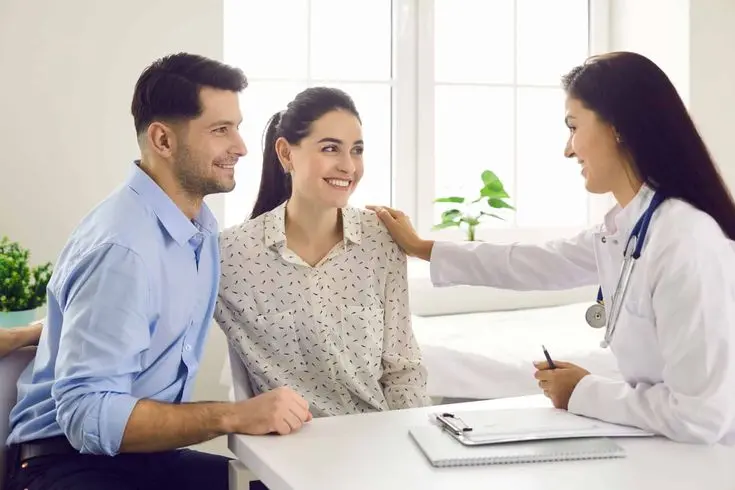 Couple consulting with a doctor