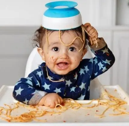 When Should You Introduce Solid Foods to Your Baby? A Complete Guide for Parents 6 Baby doing mess with his food