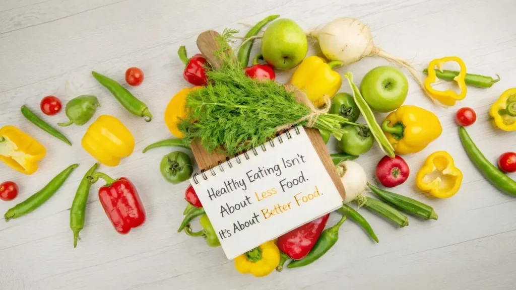 Vibrant healthy produce with motivational notebook quote on healthy eating