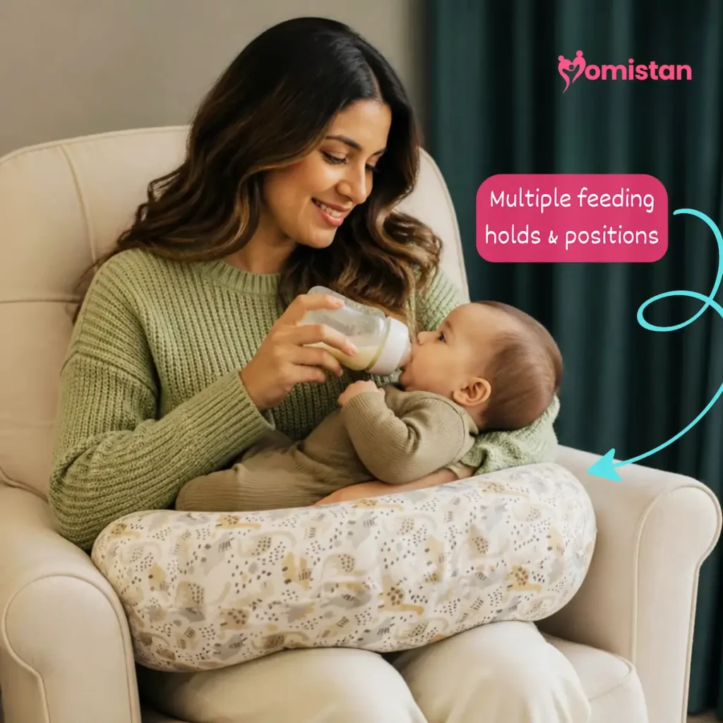 Mother bottle-feeding baby with nursing pillow